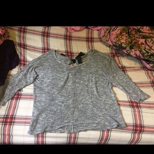A grey bow shirt